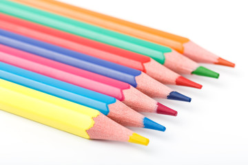 Fototapeta premium Color pencils isolated on white background. Many different colored pencils. Colored drawing pencils in a variety of colors