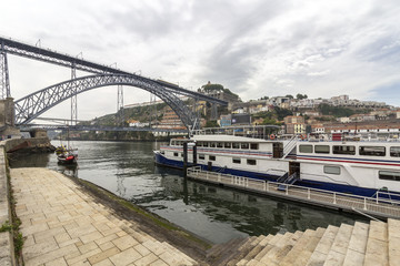 View of Ribeira historical quarter, on the margin Douro river embankment Oporto old town and  Luis I bridge, Porto.