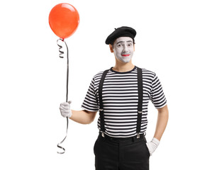 Mime artist with a balloon
