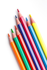 Fototapeta premium Color pencils isolated on white background. Many different colored pencils. Colored drawing pencils in a variety of colors