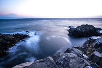 Seascape rock beach.slow shutter speed,long exposure was used to see the movement ( Soft focus due to long exposure shot)
