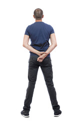 Back view of man in trousers. Standing young guy. Rear view people collection.  backside view of person.  Isolated over white background.