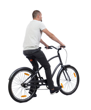 back view of a man with a bicycle. cyclist rides a bicycle. Rear view people collection.  backside view of person. Isolated over white background.