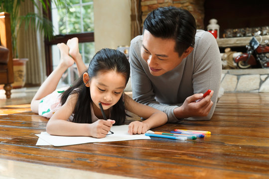 Father helping daughter with her study
