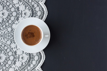 Turkish coffee on a lace and black background