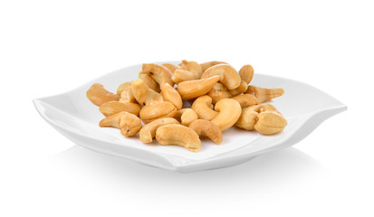 Cashews in modern ceramic plate (beautiful shape) on white background
