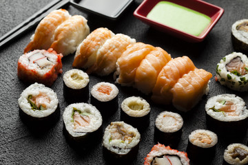 Sushi set on black table background