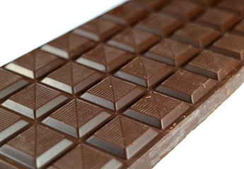 Closed up chocolate bar isolated on white background with selective focus 