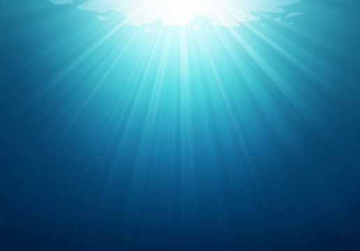Underwater blue sea background photo with with sun and sunlight shining under the sea.
