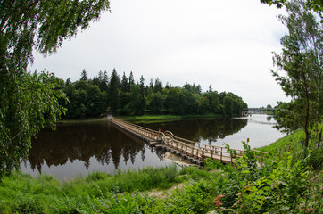 River landscape. Wooden pontoon bridge. Latvia.