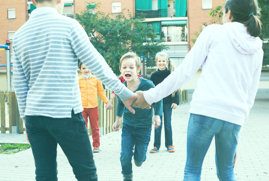 Group Of Children Playing Red Rover