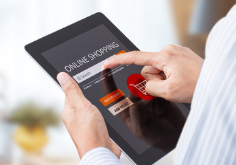 businessman doing online shopping on tablet