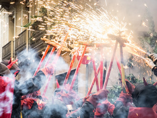 Correfocs (fire runs), demons and fire in the streets of Gracia Festival (Barcelona neighborhood),...