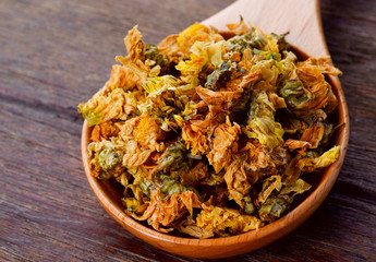 Dried Chrysanthemum flowers on wood