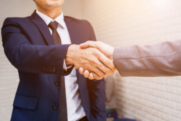 Obraz premium Blurred Business People Shaking Hand After Finish Business Meeting in Conference Room
