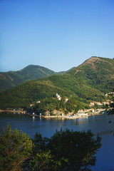 Fototapeta na wymiar View of Boko Kotorska bay in Montenegro on a hot summer day. Vacation on the beach, the morning landscape in the bay.