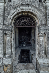 Entrance to an old family-owned mausoleum, a crypt on an abandoned Jewish cemetery