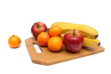 apples, tangerines and bananas close-up