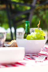 Picnic table with food and drinks

