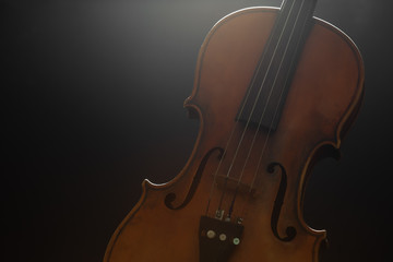 Fototapeta na wymiar Old violin on a black background