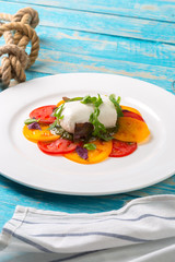 Colourful slices of cheese and tomato