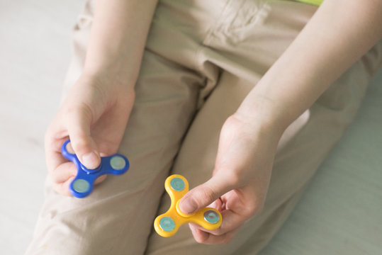 Man playing with spiners. Top view Stock photo