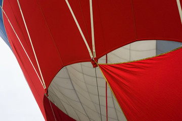 Part of a vivid red and white balloon close-up. Modern background for bright moments of life and adventure
