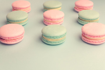 Fototapeta na wymiar Sweet pastel color macaroons in rows