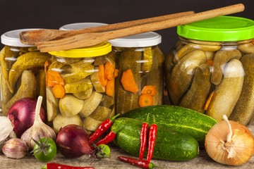 Preparing sour cucumbers in the kitchen. Pickled cucumbers in jar. Home canning vegetables. Life on the farm.