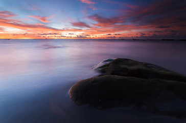 Fototapeta premium vibrant sunset at Kudat Sabah Malaysia. Image contain soft focus due to long exposure.