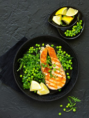 baked fish or roasted fillet or steak with peas,