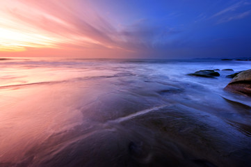 Long expose sunset with waves trails  at Kudat Sabah Malaysia. Image contain soft focus due to long...