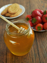 Honey, cookies and strawberries