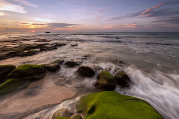 Long expose sunset with waves trails  at Kudat Sabah Malaysia. Image contain soft focus due to long...