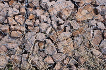 The little stones are under iron wires