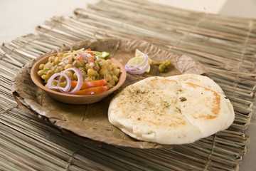 Matar kulcha or Dried yellow peas chaat with pan cooked bread