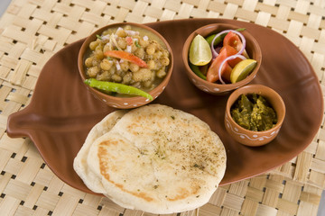 Matar kulcha or Dried yellow peas chaat with pan cooked bread