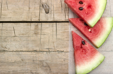 Watermelon slices on a wooden table