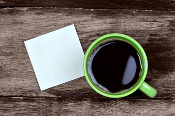 Empty notes with coffee cup on table