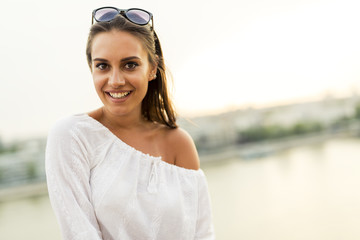 Portrait of a beautiful young woman posing outdoors