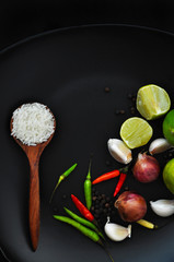 Above shot of Spice Ingredients with White Rice in Spoon