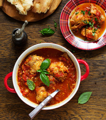 Baked rabbit in tomato sauce with rosemary and basil. Italian Cuisine.