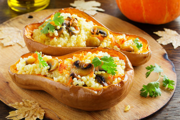 Pumpkin stuffed with couscous with grilled mushrooms.