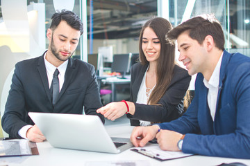 Business people working together in modern office.