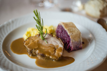 beef tagliata dish with white rice and vegetables.