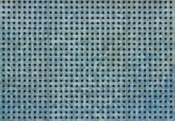Metal background with square holes. Blue steel texture.