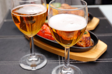 two beer glass and food background