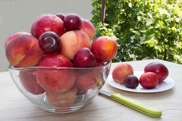 Sweet peaches, nectarine and plums. Ripe fruit on the table