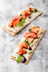 Toasts on crispbread with tomatoes