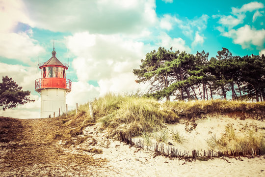 Vintage lighthouse Gellen on sunny summer day. Hiddensee, Baltic Sea.